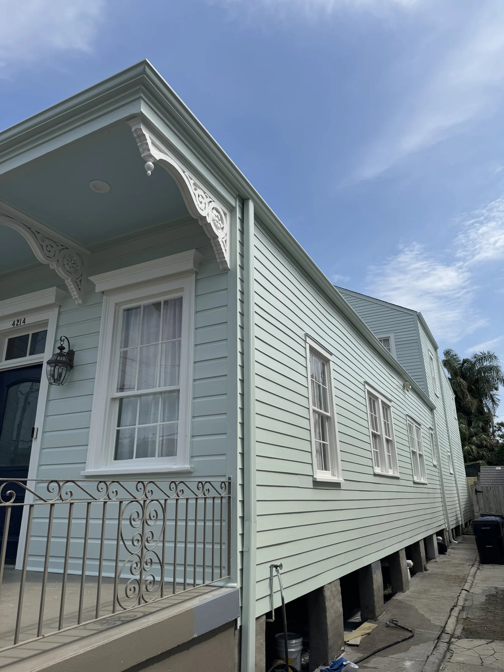 Freshly painted historic New Orleans home exterior with classic colors
